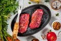 Raw beef steaks with vegetables Royalty Free Stock Photo