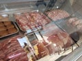 Meat in buncher shop front store  covered by jelly naylon Royalty Free Stock Photo