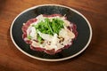 Meat carpaccio with salad