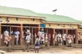 Butchers offering meat on Meat Center, Uganda. Marabu stork on roof waiting for meat waste Royalty Free Stock Photo