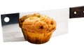 Meat cleaver cutting a cupcake Royalty Free Stock Photo