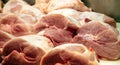 Meat concept. Raw pork in big pieces at butcher shop. Uncooked pig for background, closeup