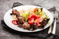 Meat and Cooked white rice mixed with colorful vegetables onion, green beans, tomato Royalty Free Stock Photo