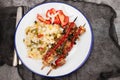 Meat and Cooked white rice mixed with colorful vegetables onion, green beans, tomato Royalty Free Stock Photo