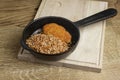 Meat cutlet with buckwheat served in a pan over rustic wooden background. Delicious dinner Royalty Free Stock Photo