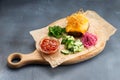 Meat cutlet with cheese with fresh vegetables on the wood Royalty Free Stock Photo