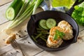 Meat cutlet from minced meat, served in a cast-iron frying pan with green beans kitchen table in a rustic style. Royalty Free Stock Photo