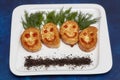 Meat cutlets in smile shape on plate. Kids menu