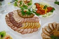 Meat delicatessen plate. Catering concept. Authentic lifestyle image