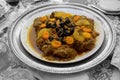 Meat dish with plum, dried pineapple and almonds. One of the most famous Moroccan dishes.