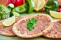 Meat with dough, manakeesh meat, flat bread with meat. Close up Royalty Free Stock Photo