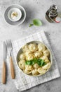 Meat dumplings - russian pelmeni, ravioli with meat on a white plate. Flat lay composition Royalty Free Stock Photo