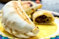 Meat empanadas with olives and red pepper.