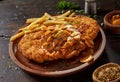 Meat escalope with French fries and chasseur sauce Royalty Free Stock Photo