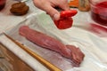 Meat fillet seasoning with pepper Royalty Free Stock Photo