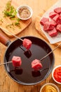 Meat fondue with spice rub and fresh herbs