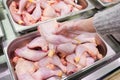 Meat in food store . Woman choosing fresh chicken meat in supermarket Royalty Free Stock Photo