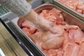 Meat in food store . Woman choosing fresh chicken meat in supermarket Royalty Free Stock Photo