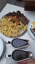 Meat with french fries add two black papper sauce Royalty Free Stock Photo