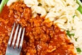 Meat goulash with macaroni pasta served on the plate