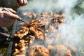 Meat on the grill. Chef cooking grilling mix of fresh grilled chicken meat Royalty Free Stock Photo