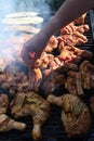 Meat on the grill. Chef cooking grilling mix of fresh grilled chicken meat Royalty Free Stock Photo