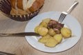 Meat grilled with potatoes on a plate. bread on the table. dinne, kitchen Royalty Free Stock Photo