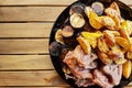 Grilled meat with vegetables on wooden table