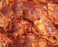 Meat heavily marinated with red hot spices Royalty Free Stock Photo