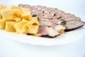 Meat home products with cheese lined on a plate Royalty Free Stock Photo