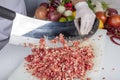 Chef is chopping the raw beef on cutting board with knife to cook in the kitchen, minced beef. Kebab restaurant, kebab preparation
