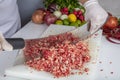 Chef is chopping the raw beef on cutting board with knife to cook in the kitchen, minced beef. Kebab restaurant, kebab preparation