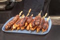 Meat kebabs on wooden skewers cooked on coals. Royalty Free Stock Photo