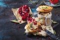 Meat liver pate on toasted bread with fruit seeds and spice herb, brown kitchen table, copy space, selective focus Royalty Free Stock Photo