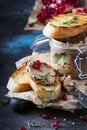 Meat liver pate on toasted bread with fruit seeds and spice herb, brown kitchen table, copy space, selective focus Royalty Free Stock Photo