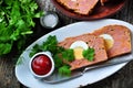 Meat loaf with boiled egg, tomato sauce, coriander and parsley on a wooden table. rustic style. Royalty Free Stock Photo