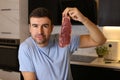Meat lover showing a delicious raw steak Royalty Free Stock Photo