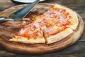 Meat lovers pizza with topping pepperoni salami sausage and ham on wooden table Royalty Free Stock Photo