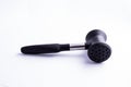 Meat mallet or tenderizer; black plastic and metal; isolated on Royalty Free Stock Photo
