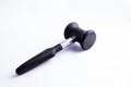 Meat mallet or tenderizer; black plastic and metal; isolated on Royalty Free Stock Photo