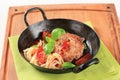 Meat patty with tomatoes and spaghetti Royalty Free Stock Photo