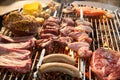 The meat is pickled on a lattice grill, ribs spread, a stake, Sausages, edges, chicken, naked flame, black pepper, a