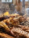 The meat is pickled on a lattice grill, ribs spread, a stake, Sausages, edges, chicken, naked flame, black pepper, a