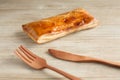 meat pie with fork knife  on table Royalty Free Stock Photo
