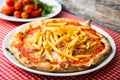 Meat pizza with french fries. Neapolitan pizza with tomato sauce and meat. Authentic Italian recipe.