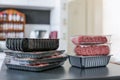 Meat in plastic packaging on a kitchen bench