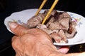 Meat on plate with chopsticks