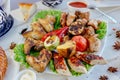 Meat plate - grilled kebabs from chiken meat, with grilled vegetables.