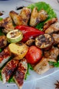 Meat plate - grilled kebabs from chiken meat, with grilled vegetables.