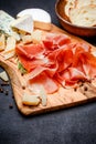 Meat plate of Italian prosciutto crudo or spanish jamon and cheese